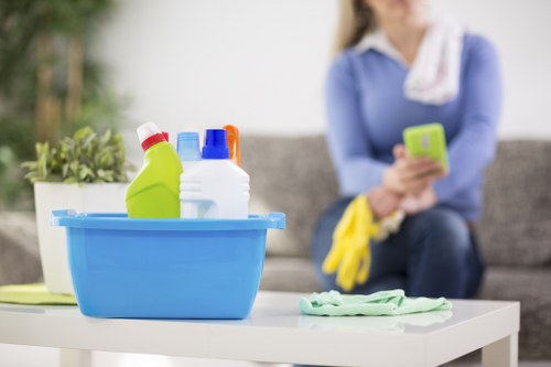 Professional carpet cleaner managing hoses and equipment safely indoors